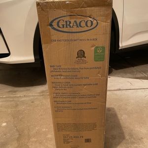 Brand new Graco Crib and Toddler Mattress